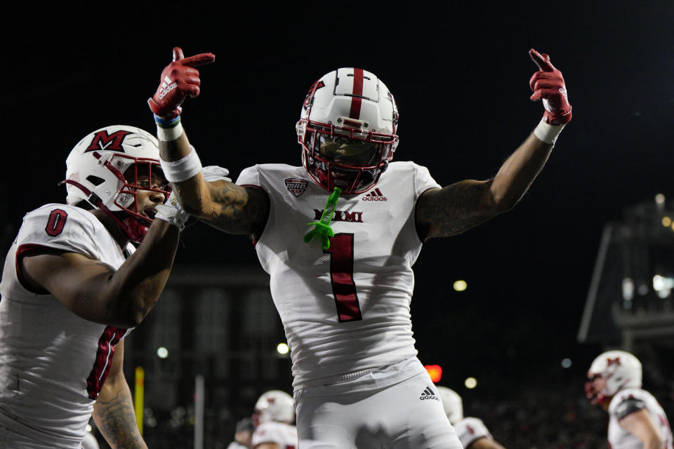 Miami (Ohio) wide receiver Joe Wilkins Jr. (1) celebrates after scoring a touchdown during overtime in an NCAA college football game against Cincinnati, Saturday, Sept. 16, 2023, in Cincinnati. (AP Photo/Jeff Dean)