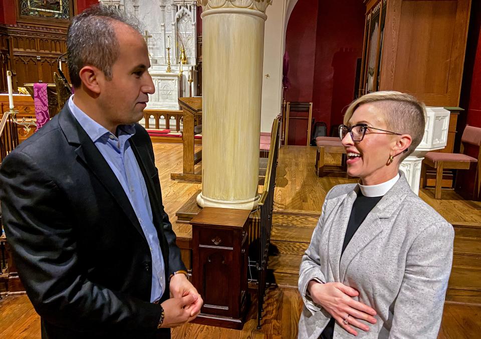 Muhammad Sezer, director of Dialogue Institute-Oklahoma and Turkish Raindrop House, talks with the Rev. Katie Churchwell, dean of St. Paul's Episcopal Cathedral, after an interfaith prayer vigil for Turkey and Syria on Tuesday at St. Paul's, 127 NW 7.
