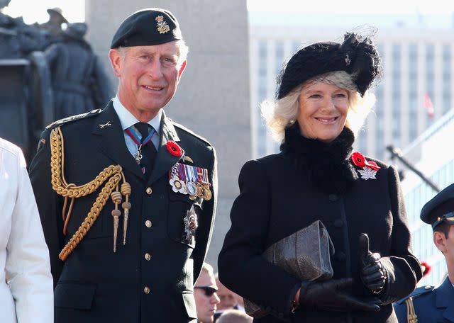 <p>Chris Jackson/Getty</p> Prince Charles, Prince of Wales and Camilla, Duchess of Cornwall look on as they attend a Remembrance Day Service at the National War Memorial in Ottawa, Canada in 2009.