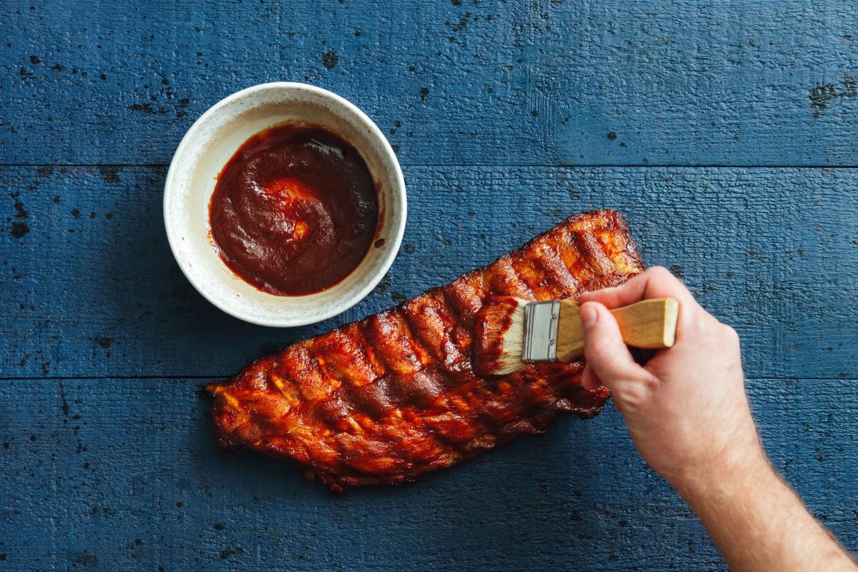 Barbecue Ribs Being Brushed with Barbecue Sauce