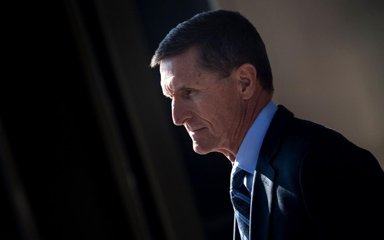 Gen. Michael Flynn, former national security adviser to US President Donald Trump, leaves Federal Court on in Washington, DC - AFP