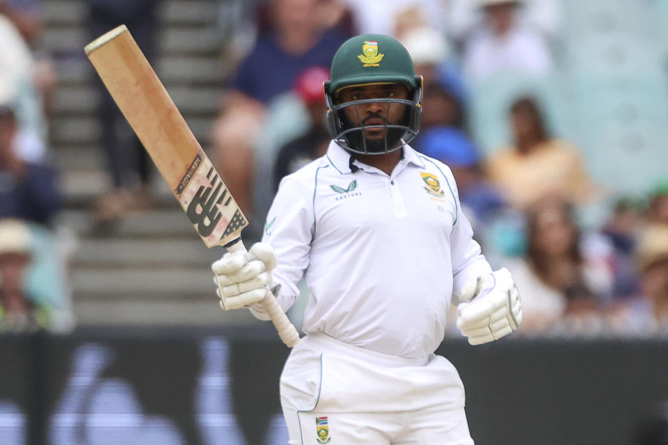 South Africa's Temba Bavuma raises his bat after reaching his fifty runs during the second cricket test between South Africa and Australia at the Melbourne Cricket Ground, Australia, Thursday, Dec. 29, 2022. (AP Photo/Asanka Brendon Ratnayake)