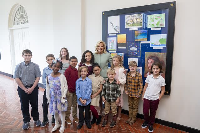 <p>Official White House Photographer Erin Scott</p> First lady Jill Biden stands at the Military Children's Corner with young artists whose works are now displayed in the White House