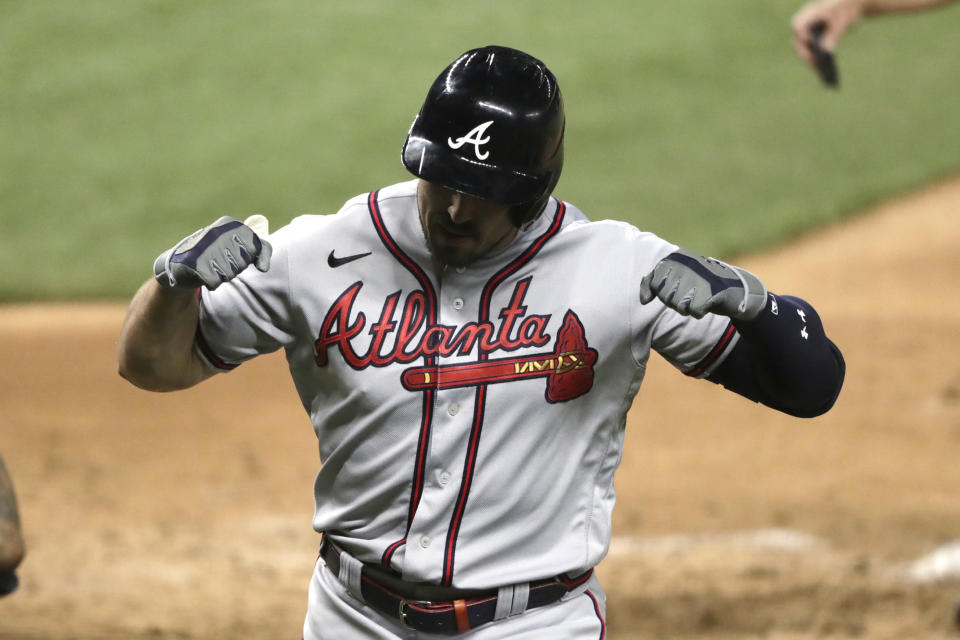 Atlanta Braves' Adam Duvall reacts after scoring on a solo home run during the ninth inning of a baseball game against the Miami Marlins, Saturday, Aug. 15, 2020, in Miami. The Braves won 2-1. (AP Photo/Lynne Sladky)