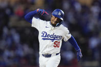 Los Angeles Dodgers' Mookie Betts celebrates his home run during the first inning of a baseball game against the St. Louis Cardinals Friday, March 29, 2024, in Los Angeles. (AP Photo/Jae C. Hong)