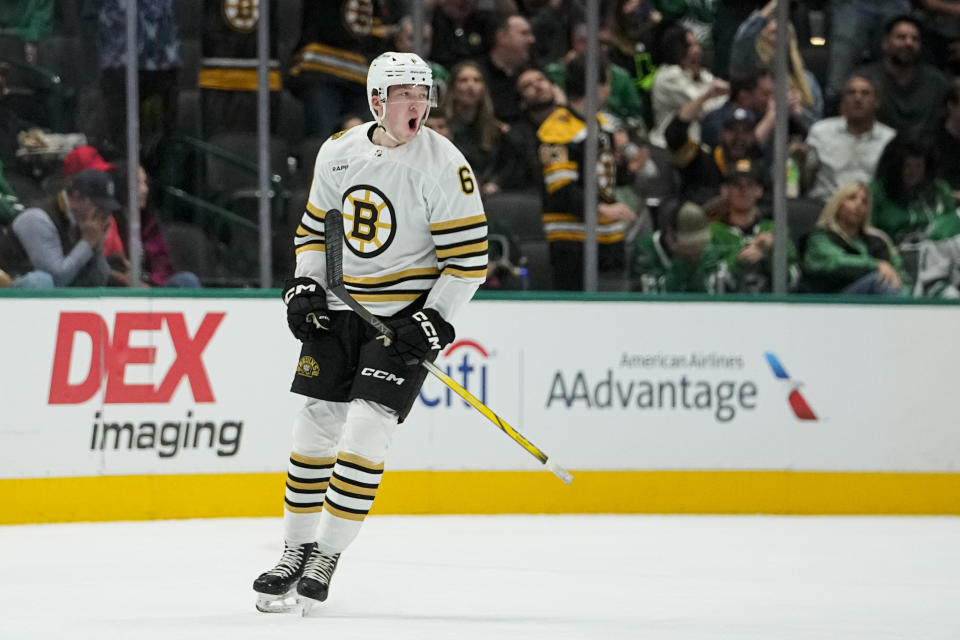 Boston Bruins defenseman Mason Lohrei reacts after scoring a goal against the Dallas Stars during the first period of an NHL hockey game, Monday, Nov. 6, 2023, in Dallas. (AP Photo/Julio Cortez)