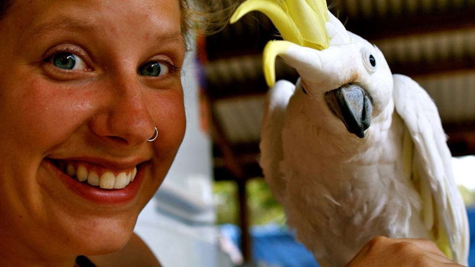 Mum Tanja Ludwig pictured with a bird. She died with her toddler daughter on Tuesday. Both went over the Robertson Lookout in the Illawarra region.