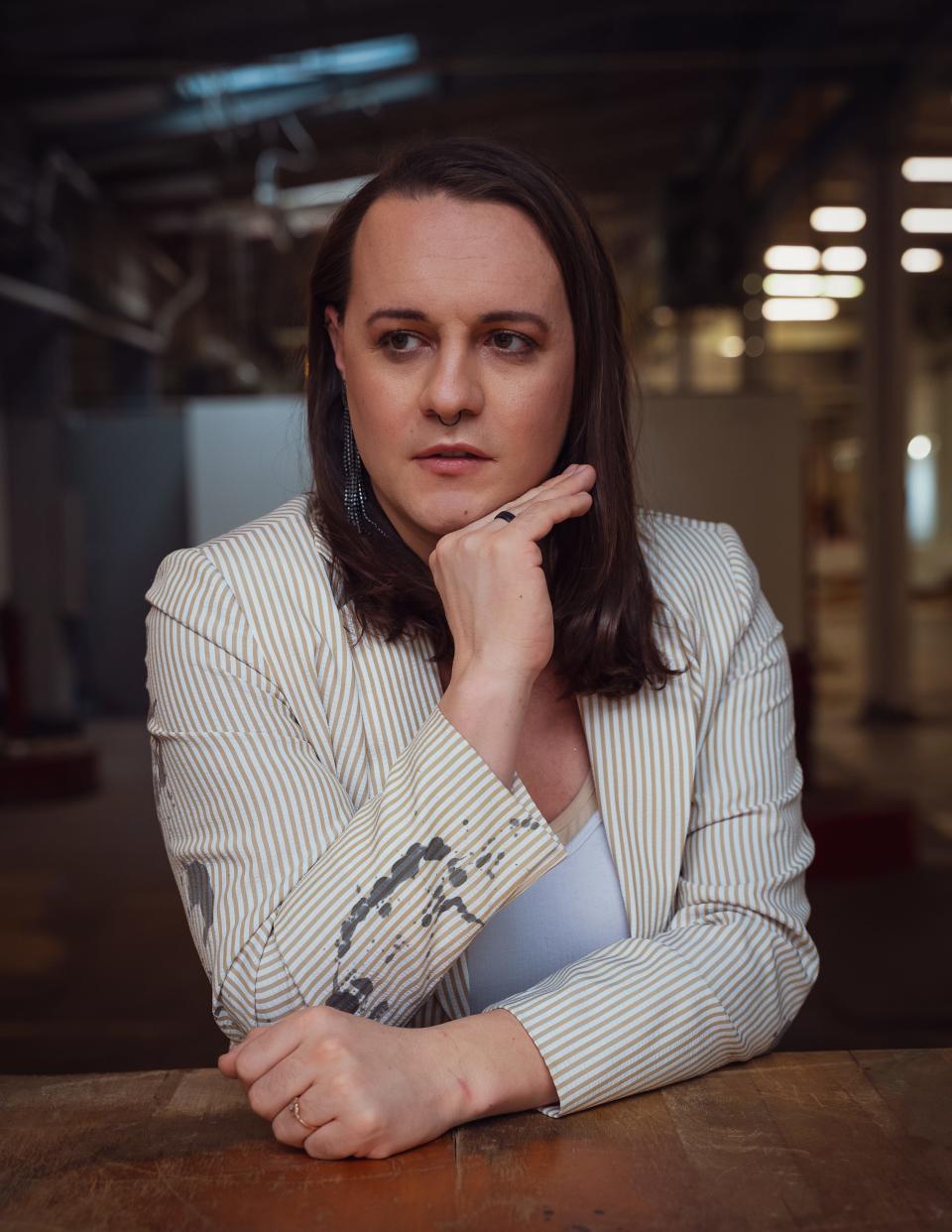 Vincent-Natasha Gay poses for their photograph that is part of their "This is Trans" photo exhibition, which is on display at the Milwaukee LGBT Center in July and August of 2023.