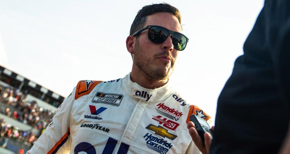 Alex Bowman speaks to reporters after a NASCAR race at Pocono.