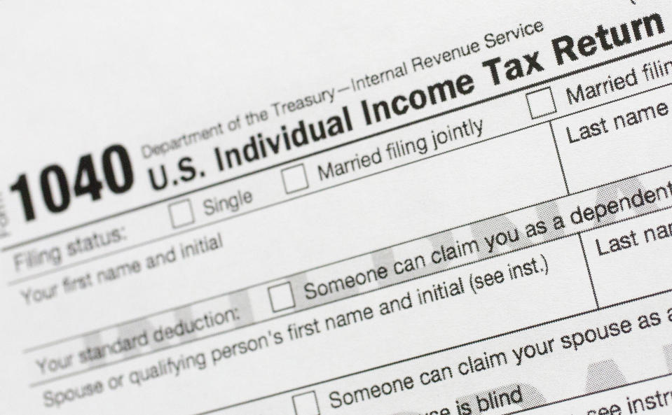 FILE - A portion of the 1040 U.S. Individual Income Tax Return form is shown July 24, 2018, in New York. The IRS said Tuesday, June 21, 2022, that it will have erased its backlog of last season's tax returns by the end of this week. (AP Photo/Mark Lennihan, File)