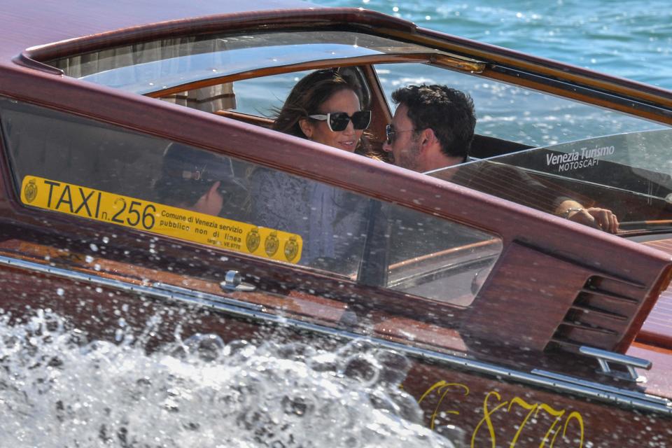 Ben Affleck and Jennifer Lopez travel across the Venice basin towards the Cipriani Hotel aboard a vaporetto taxi boat on Sept. 9, 2021 after they arrived to attend the 78th Venice Film Festival in Venice.