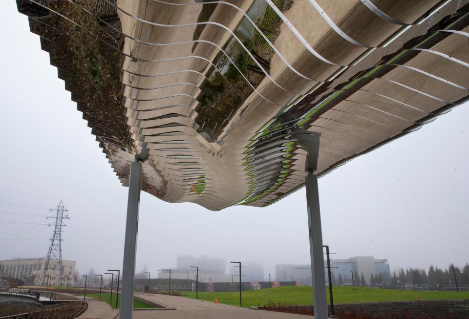 An overhead art installation mimics the topography of the nearby river at the new Downtown Riverfront Park in Eugene.