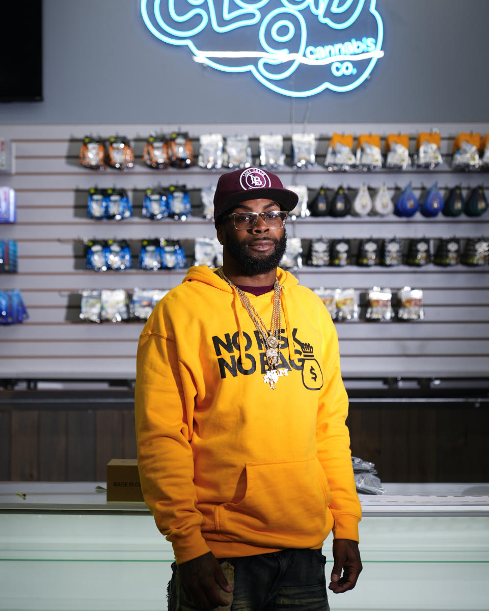 Cloud 9 Cannabis CEO and co-owner Sam Ward Jr. poses at his shop, Thursday, Feb. 1, 2024, in Arlington, Wash. Cloud 9 is one of the first dispensaries to open under the Washington Liquor and Cannabis Board's social equity program, established in efforts to remedy some of the disproportionate effects marijuana prohibition had on communities of color. (AP Photo/Lindsey Wasson)