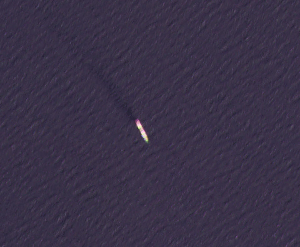 This Wednesday, April 7, 2021, satellite photo by Planet Labs Inc. shows the MV Saviz in the Red Sea as it leaks oil. An attack Tuesday on the Iranian cargo ship said to serve as a floating base for its paramilitary Revolutionary Guard off Yemen has escalated a yearslong shadow war on Mideast waters, just as world powers negotiate over Tehran's tattered nuclear deal. (Nournews via AP)(Planet Labs Inc. via AP)