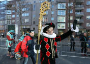 "Zwarte Piet" (Black Pete), who is a Saint Nicholas' assistant is seen during a traditional parade in Amsterdam, Netherlands, November 18, 2018. REUTERS/Eva Plevier