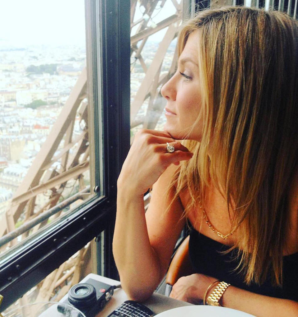 <p>Speaking of romance, Jennifer Aniston dined with Justin Theroux at the Eiffel Tower in February 2016. He shared this photo of his new bride (and that blinding ring!) that he captioned with a rose. (Photo: <a rel="nofollow noopener" href="https://www.instagram.com/p/BByQX_mQ4nS/?hl=en" target="_blank" data-ylk="slk:Justin Theroux via Instagram;elm:context_link;itc:0;sec:content-canvas" class="link ">Justin Theroux via Instagram</a>) </p>