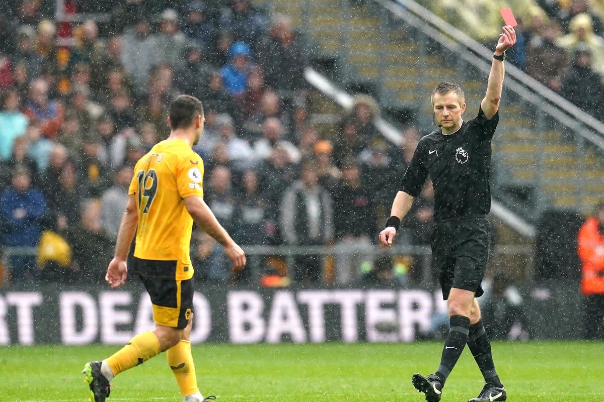 Wolverhampton Wanderers’ Jonny (left) is shown a red card (Nick Potts/PA) (PA Wire)