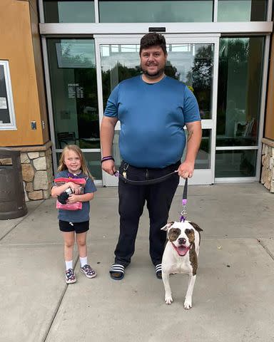 <p>Bradshaw Animal Shelter</p> Steven Tyler the rescue dog, later renamed Donner, leaving the Bradshaw Animal Shelter with his new family