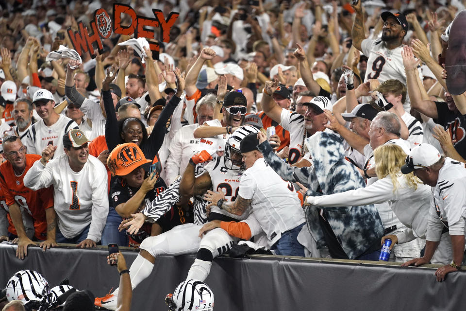 Cincinnati Bengals running back Joe Mixon celebrates with fans after scoring during the second half of an NFL football game against the Los Angeles Rams, Monday, Sept. 25, 2023, in Cincinnati. (AP Photo/Darron Cummings)