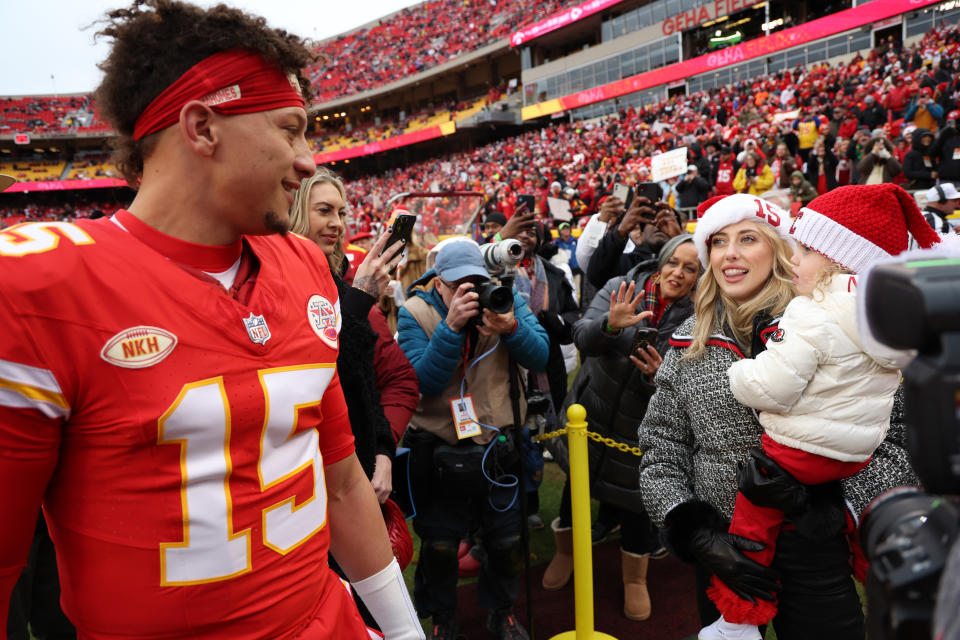 KANSAS CITY, MISSOURI - DECEMBER 25: Patrick Mahomes #15 of the Kansas City Chiefs greets his wife Brittany and daughter Sterling Skye prior to a game against the Las Vegas Raiders at GEHA Field at Arrowhead Stadium on December 25, 2023 in Kansas City, Missouri. (Photo by Jamie Squire/Getty Images)