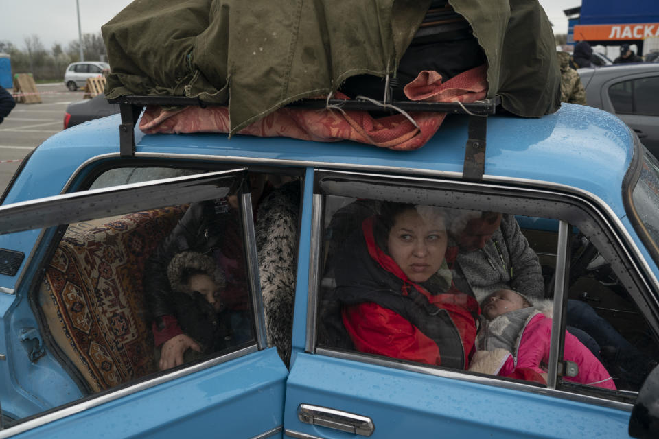 FILE - Internally displaced people from Mariupol and nearby towns arrive at a refugee center fleeing from the Russian attacks, in Zaporizhzhia, Ukraine, Thursday, April 21, Quantifying the toll of Russia’s war in Ukraine remains an elusive goal a year into the conflict. Estimates of the casualties, refugees and economic fallout from the war produce an complete picture of the deaths and suffering. Precise figures may never emerge for some of the categories international organizations are attempting to track. (AP Photo/Leo Correa, File)
