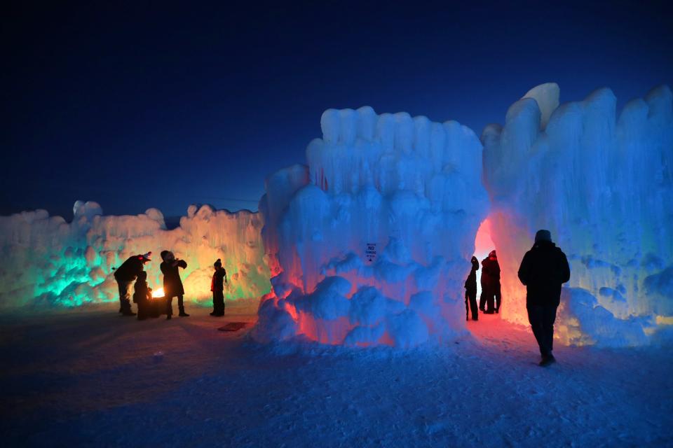 LED lights illuminate the ice formations at the Ice Castles display in Lake Geneva in January 2019.