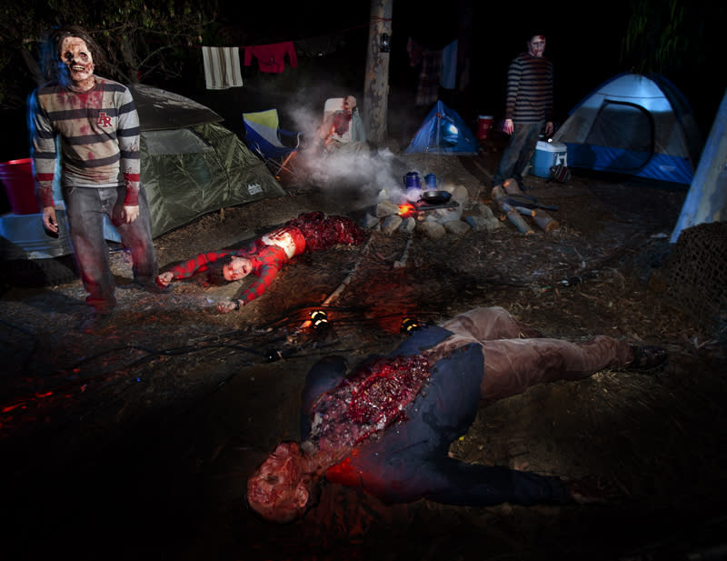 This September 2012 photo provided by Universal Studios Hollywood shows an attraction inspired by the AMC zombie series “The Walking Dead.” Guests attending the California theme park’s Halloween Horror Nights are dropped off by the “Terror Tram” to wander around the park’s studio backlot, where they can encounter the ghoulish zombies. (AP Photo/Universal Studios Hollywood)