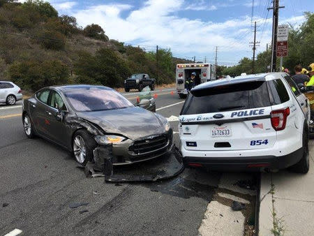 A Tesla sedan is shown after it struck a parked Laguna Beach Police Department vehicle in Laguna Beach, California, U.S. in this May 29, 2018 handout photo. Laguna Beach Police Department/Handout via REUTERS