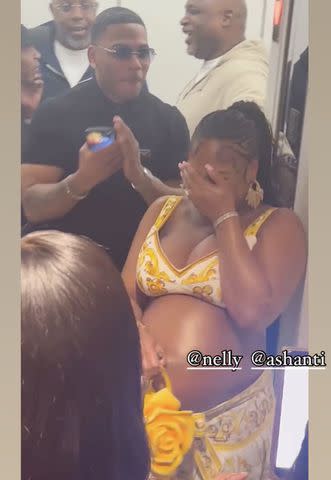 <p>Supplied</p> Nelly and pregnant Ashanti arriving at her surprise baby shower