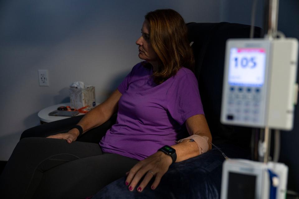 Michele Hall, 55, receives her eighth Aduhelm treatment/infusion at a local clinic in St. Petersburg, Fla., on Aug. 3, 2022. Hall was diagnosed with early onset Alzheimer’s disease in fall 2020. | Martha Asencio-Rhine, Tampa Bay Times