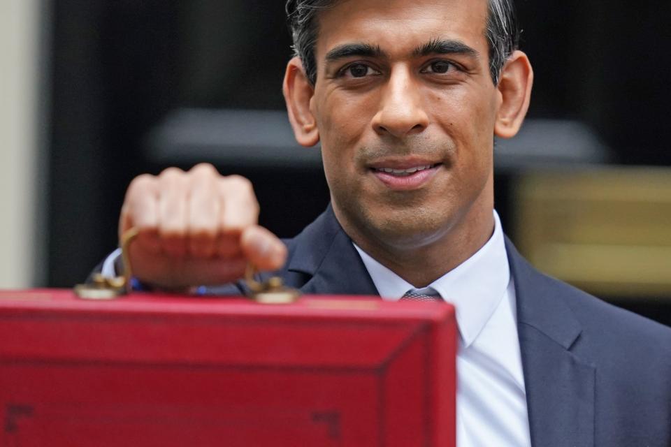 Rishi Sunak pictured with the famous ministerial red box (PA)