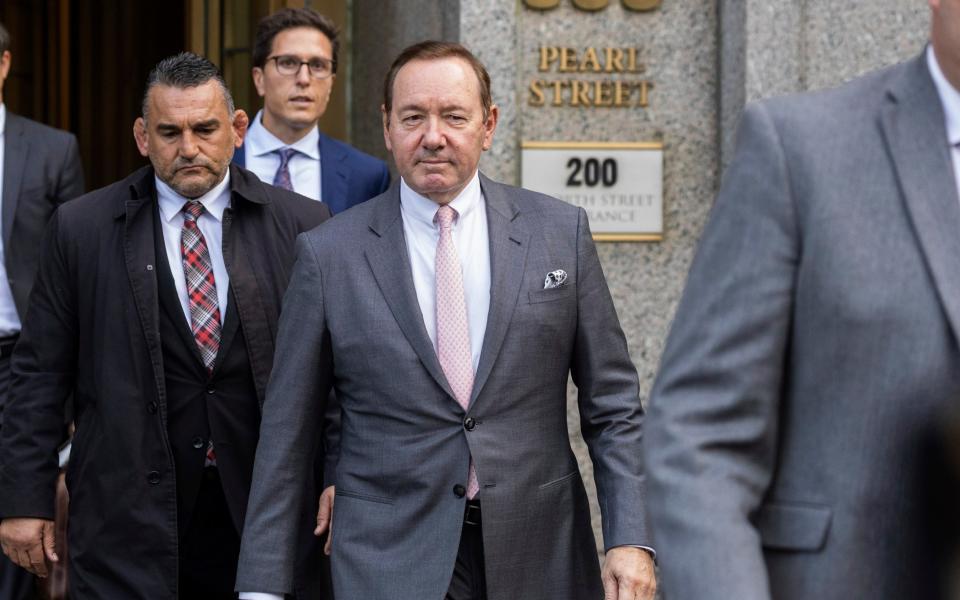 Actor Kevin Spacey, centre, leaves court in New York after a hearing earlier this week - Yuki Iwamura /AP