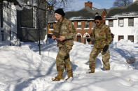 National guard members check on residents, Wednesday, Dec. 28, 2022, in Buffalo N.Y., following a winter storm. (AP Photo/Jeffrey T. Barnes)