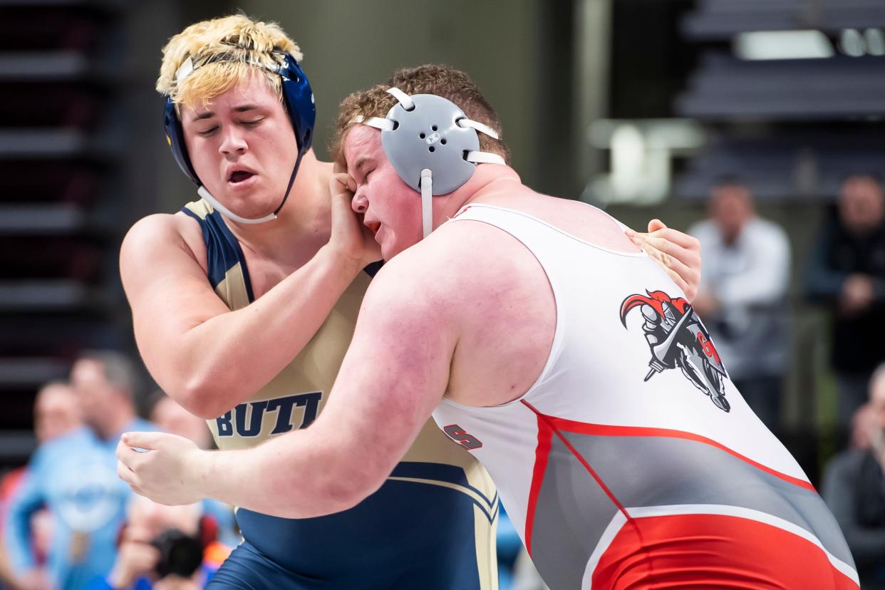 General McLane's Wilson Spires, right, wrestles Butler's Jake Pomykata in a 285-pound preliminary bout at the PIAA Class 3A Wrestling Championships at the Giant Center on Thursday, March 10, 2022, in Derry Township. Spires won by decision, 3-2.