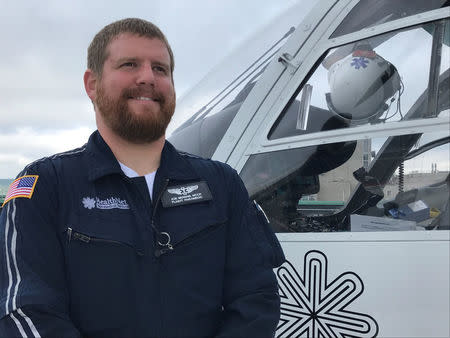 Joe Berens, HealthNet Aeromedical Services flight paramedic poses on the rooftop helipad at West Virginia University Hospital in Morgantown, West Virginia, September 7, 2017. Photo taken September 7, 2017. REUTERS/Mike Wood