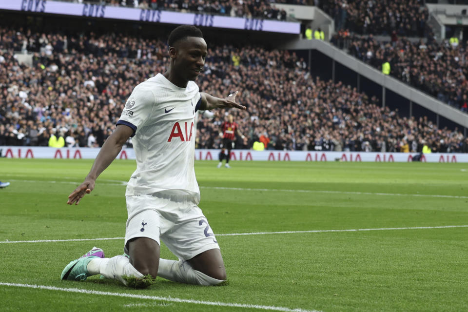 Tottenham's Pape Matar Sarr celebrates after scoring his side's opening goal during the English Premier League soccer match between Tottenham Hotspur and AFC Bournemouth at the Tottenham Hotspur Stadium in London, Sunday, Dec. 31, 2023. (AP Photo/Ian Walton)
