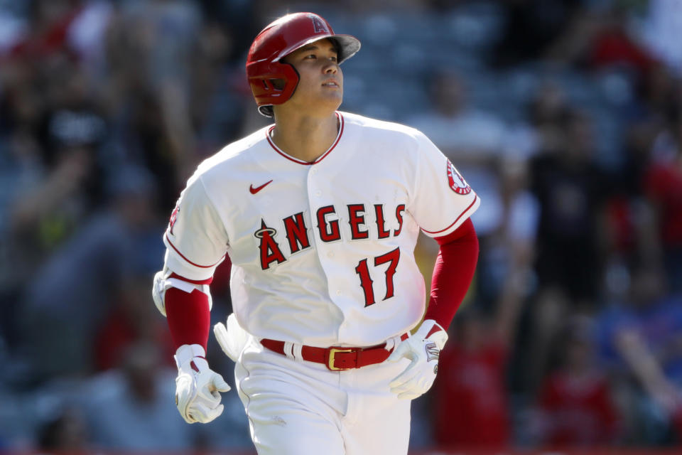 Los Angeles Angels designated hitter Shohei Ohtani watches his two-run home run against the Seattle Mariners during the ninth inning of a baseball game in Anaheim, Calif., Sunday, July 18, 2021. (AP Photo/Alex Gallardo)