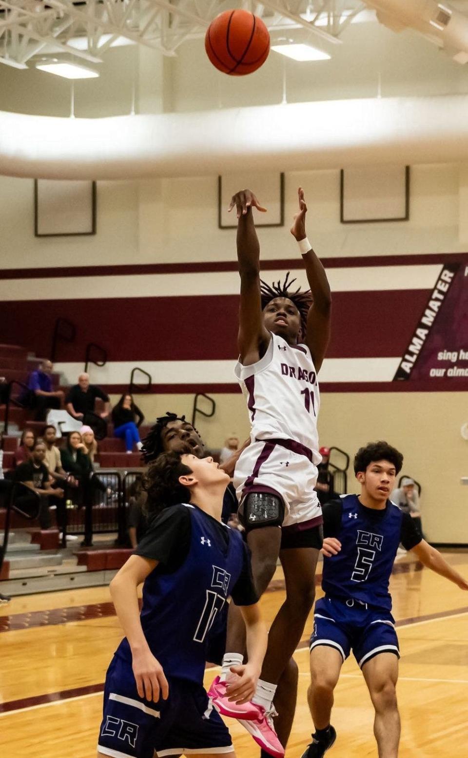 Andre Griffin puts up a shot for Round Rock, which beat Cedar Ridge 56-35 Friday to secure a postseason berth.