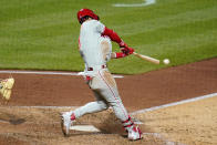 Philadelphia Phillies' Bryce Harper hits an RBI single off Pittsburgh Pirates relief pitcher David Bednar during the eighth inning of a baseball game in Pittsburgh, Saturday, July 31, 2021. (AP Photo/Gene J. Puskar)