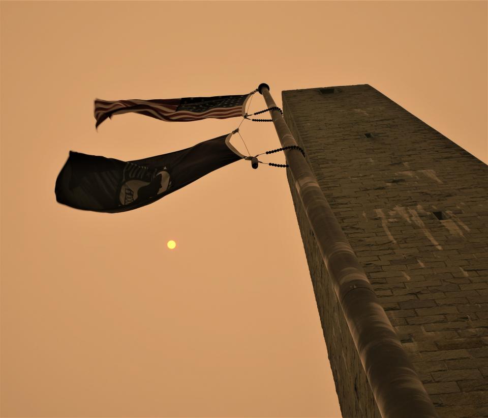 Shooting a picture looking directly at the noonday sun is not usually possible, except when a thick blanket of forest fire smoke from Canada drifts over northwestern New Jersey over the Veterans Memorial Monument atop High Point in Stokes State Forest in Sussex County. The 220-foot-tall obelisk sits atop the highest point in New Jersey at 1,803 feet above sea level.