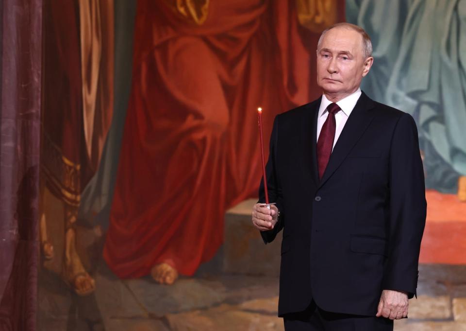 Vladimir Putin attends the Orthodox Easter service at the Cathedral of Christ the Saviour in Moscow (EPA)