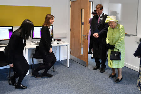 Queen Elizabeth II meets music students during a visit to King's Bruton School where she will mark the School's 500th anniversary and open the new Music Centre, in Bruton, Somerset, Britain March 28, 2019. Ben Birchall/Pool via REUTERS