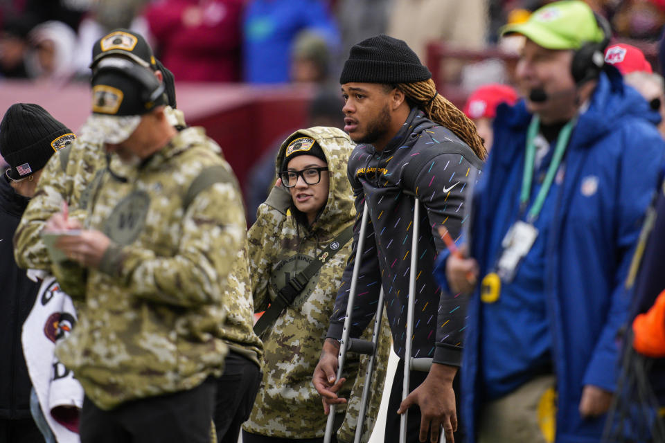 Washington Football Team defensive end Chase Young uses crutches on the sideline during the second half of an NFL football game against the Tampa Bay Buccaneers, Sunday, Nov. 14, 2021, in Landover, Md. (AP Photo/Nick Wass)