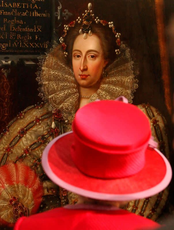 FILE PHOTO: Britain's Queen Elizabeth II looks at portrait of Queen Elizabeth I during visit to Westminster Abbey and Westminster School in London