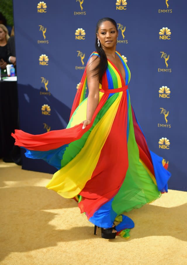 Tiffany Haddish twirling in rainbow dress