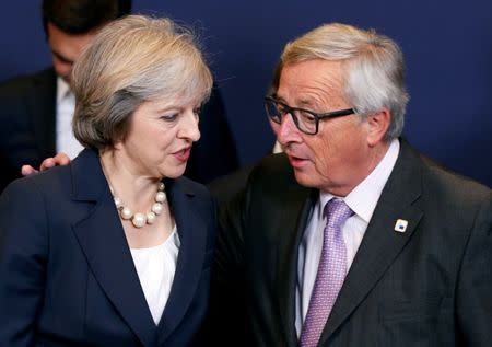 Prime Minister Theresa May talks to European Commission President Jean-Claude Juncker during a European Union leaders summit in Brussels, Belgium, October 20, 2016. REUTERS/Francois Lenoir