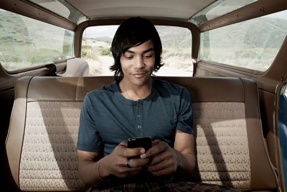 Young man using smartphone.