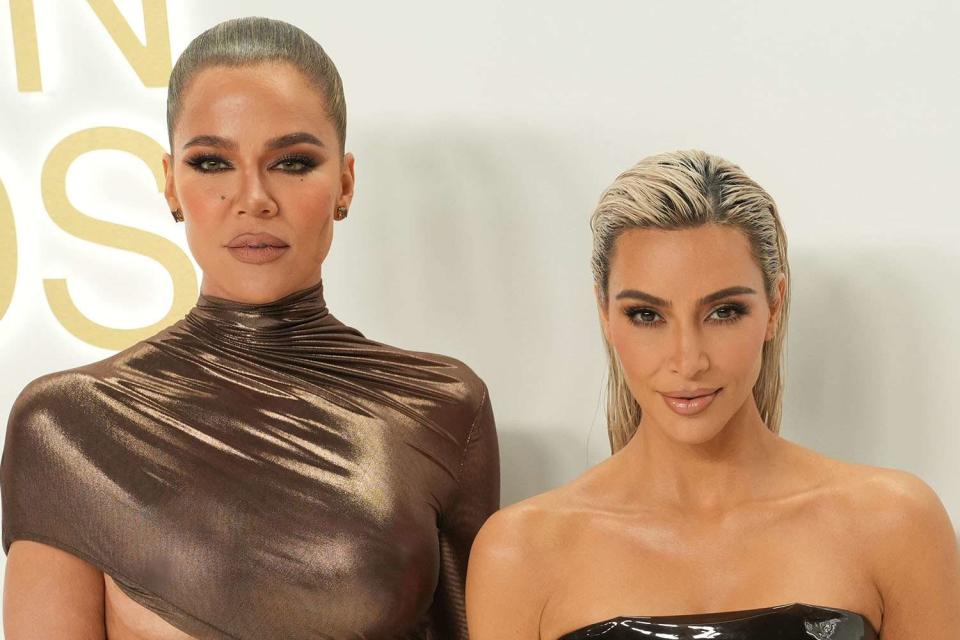 <p>Sean Zanni/Patrick McMullan via Getty</p> Khloé Kardashian and Kim Kardashian at the 2022 CFDA Fashion Awards