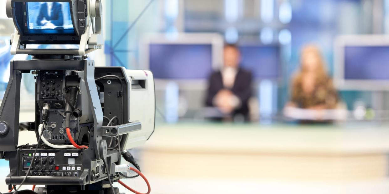 Newcast broadcast camera newsroom reporters on live TV