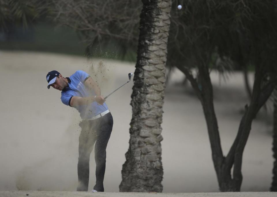 Martin Kaymer of Germany plays a shot on the 14th hole during the 1st round of the Dubai Desert Classic golf tournament in Dubai, United Arab Emirates, Thursday, Feb. 2, 2017. (AP Photo/Kamran Jebreili)